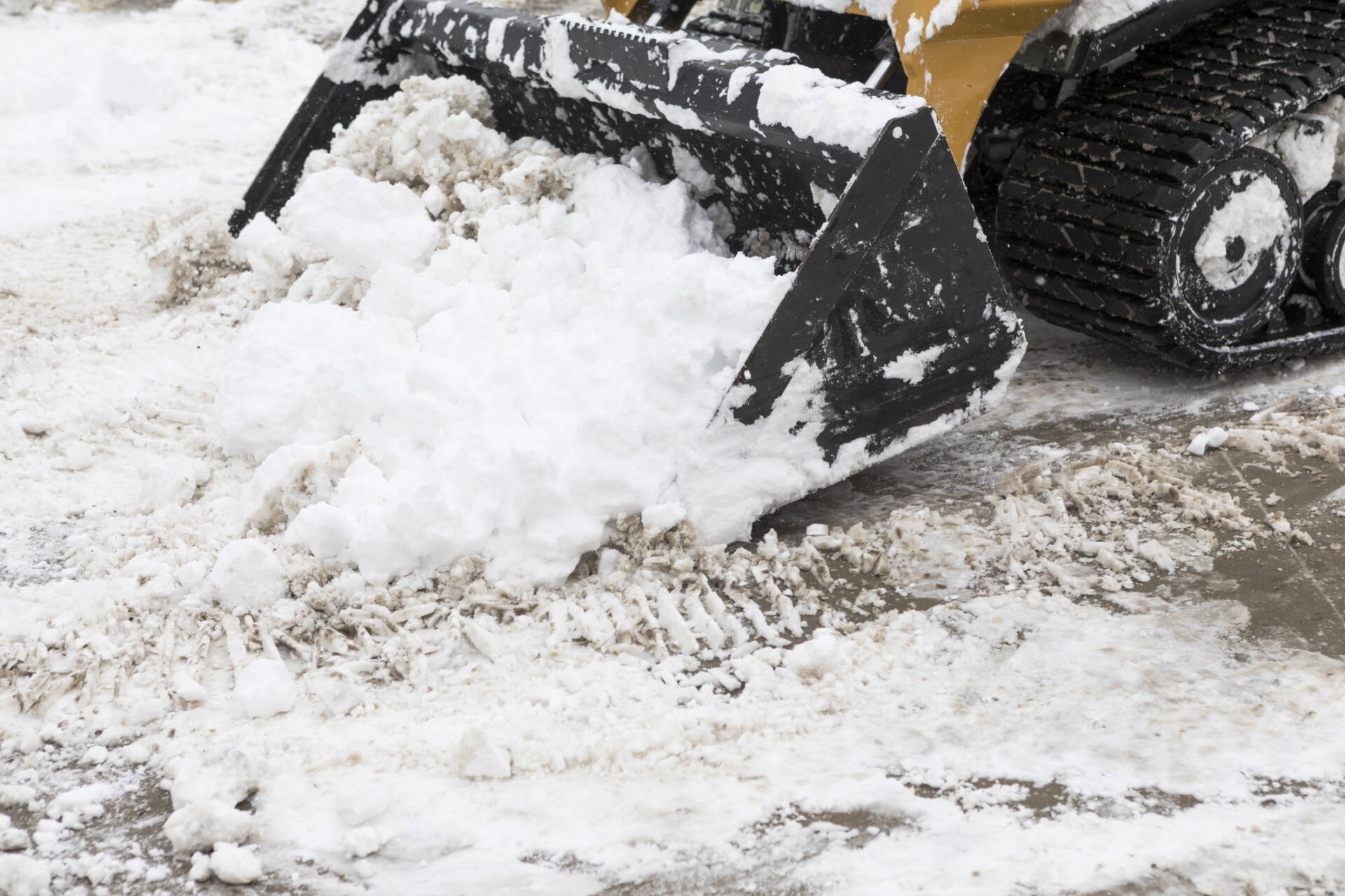 Skid Loader Removing Snow